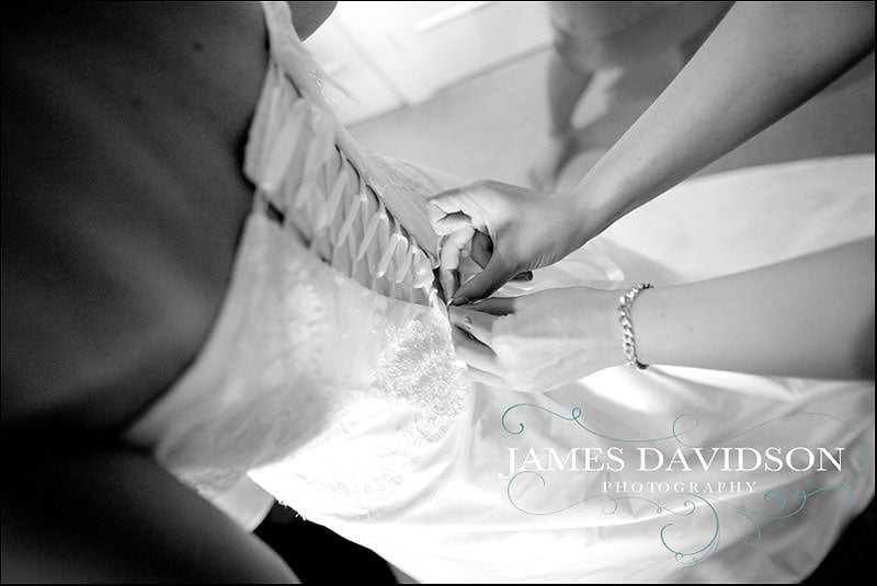 priory hall wedding 009 doing up wedding dress
