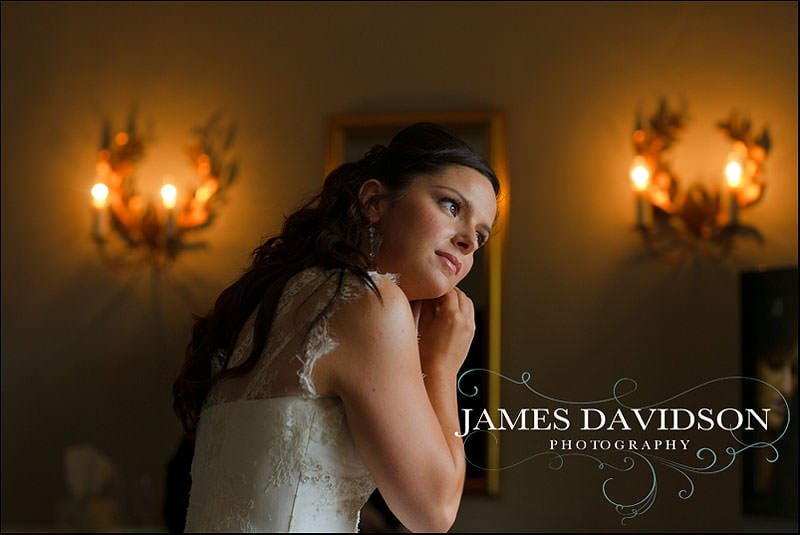 priory hall wedding 011 bride putting on earrings