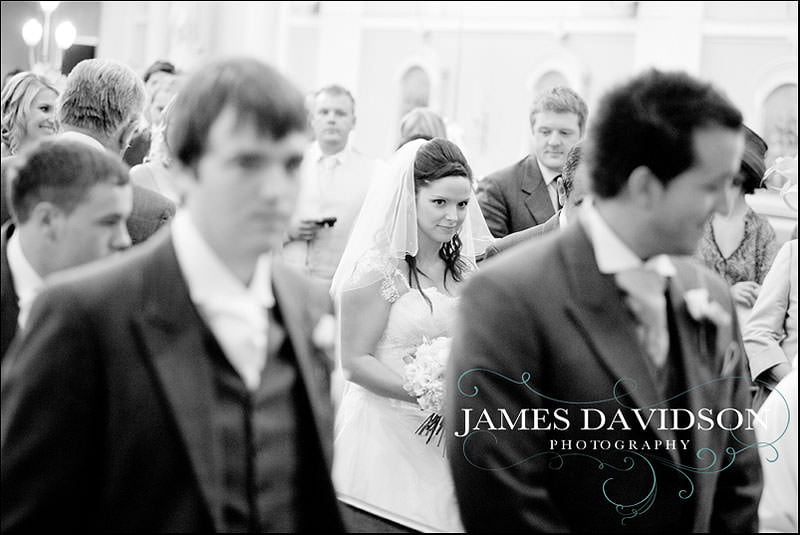 priory hall wedding 019 bride walking down the aisle