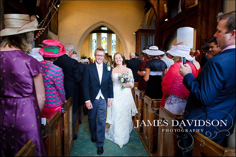 surrey wedding photographer 12 bride and groom walking down the aisle