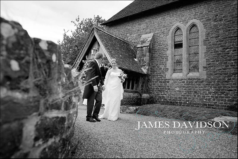 surrey wedding photographer 13 bride and groom leaving church
